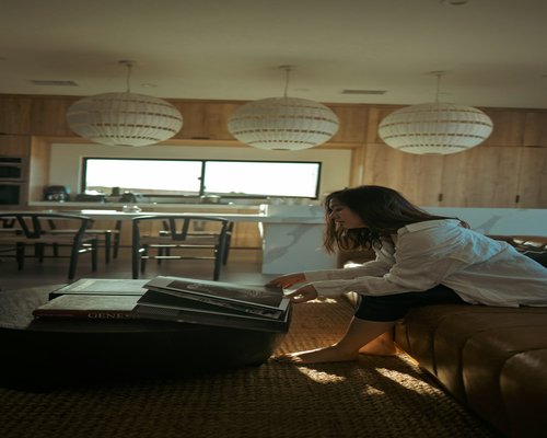 Person doing light stretching and organizing home living room